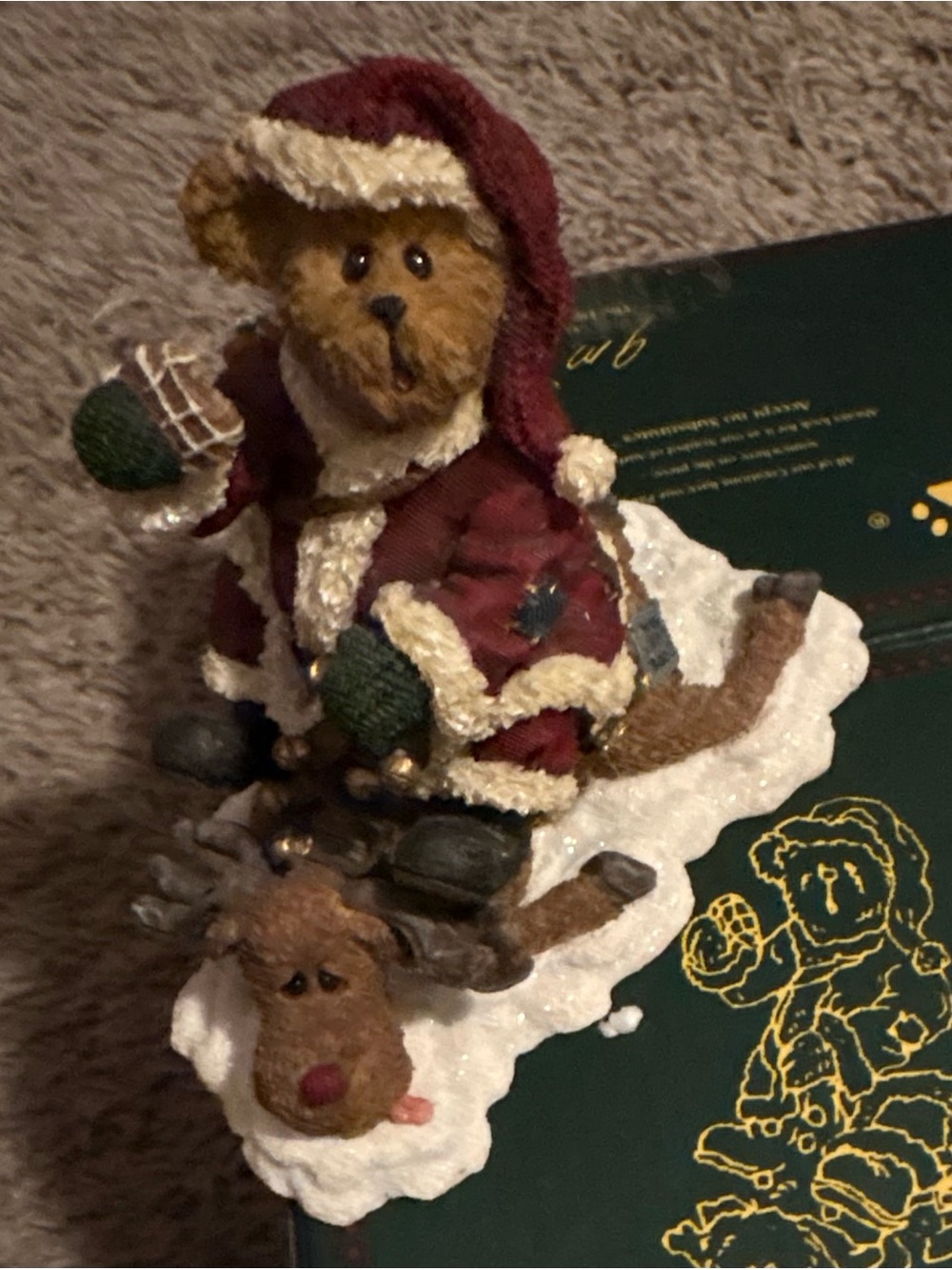 NWT
Boyds Bears Holiday Bear Figurine with Green Mittens sitting on a moose.